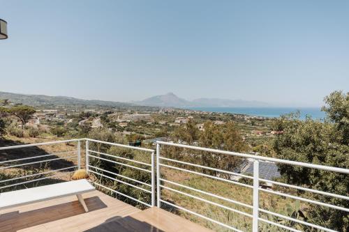a view of the ocean from the balcony of a house at Villa Michela - Dimora di Charme a Cefalù con panorama sul mare in Cefalù