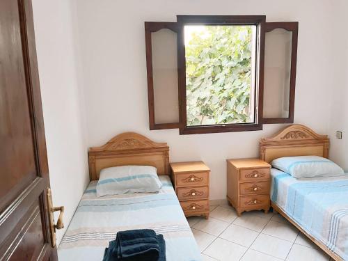 Ένα ή περισσότερα κρεβάτια σε δωμάτιο στο Villa CaboNegro - Family only