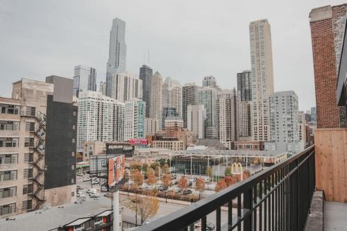 a view of a city skyline with tall buildings at River North Private Balcony With In and Out Parking in Chicago