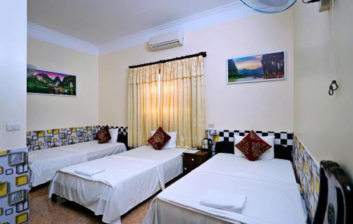 a hospital room with three beds and a window at Ninh Binh Alisa Hotel in Ninh Binh