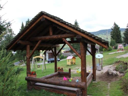 a model of a gazebo with a playground at Rustic Chalet for Families in Le Ménil