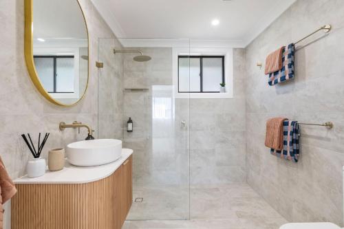 a bathroom with a sink and a mirror at Lucille in Mollymook