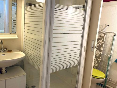 a bathroom with a shower with a toilet and a sink at T2 Mezzanine aux Sables d'Olonne - Balcon, Proche Plage et Commerces - FR-1-92-745 in La Pironnière