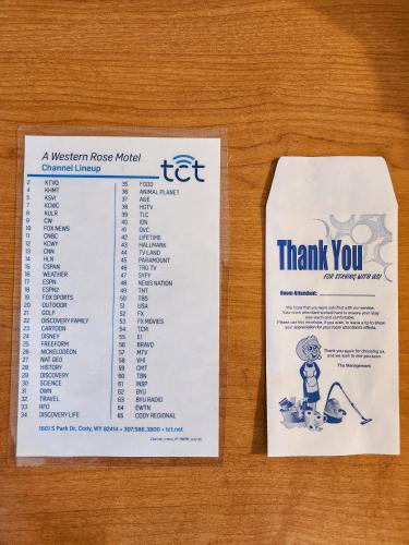 a ticket on a table with a thank you sign at A Western Rose in Cody