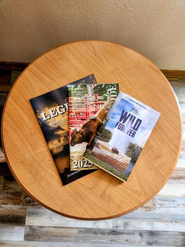 two magazines sitting on a wooden table at A Western Rose in Cody