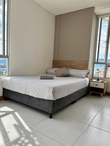 Ένα ή περισσότερα κρεβάτια σε δωμάτιο στο Edificio Plaza U Wellness