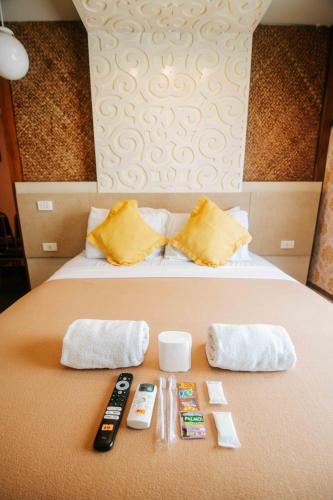Ένα ή περισσότερα κρεβάτια σε δωμάτιο στο Villa Rosita Hotel Naga City by RedDoorz