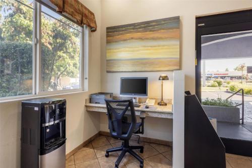 an office with a desk with a computer and a chair at Best Western Inn Santa Clara in Santa Clara