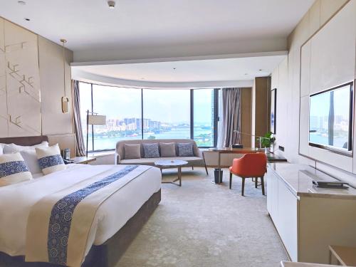 Un ou plusieurs lits dans un hébergement de l'établissement LIUZHOU PENGYI Hotel