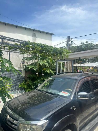 a black car parked in front of a house at Happy House Gành Dầu in Phu Quoc