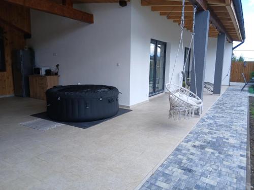 a large black tire sitting in the middle of a patio at Popa Cabana in Sibiu