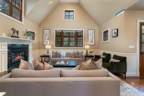 a living room with a couch and a fireplace at Spacious Designer 3BR Victorian with AC & Hot Tub in Aspen