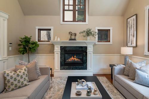 a living room with a fireplace and a couch at Spacious Designer 3BR Victorian with AC & Hot Tub in Aspen