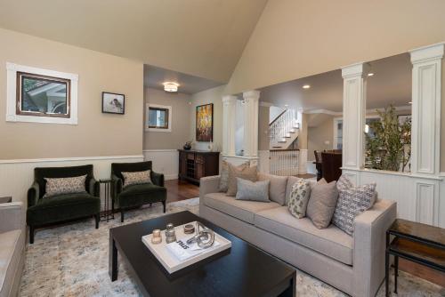 a living room with a couch and a table at Spacious Designer 3BR Victorian with AC & Hot Tub in Aspen