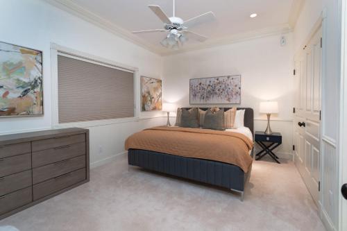 a bedroom with a bed and a ceiling fan at Spacious Designer 3BR Victorian with AC & Hot Tub in Aspen