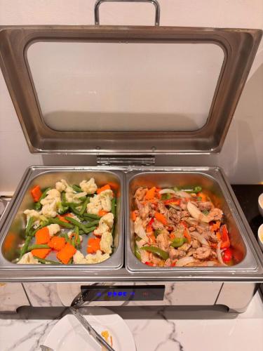 two trays of food in a refrigerator at 22 Land Hotel in Hanoi