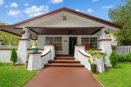 a home with a pathway leading to the front door at Spacious Family 3BR Near Wynwood and Beach in Miami
