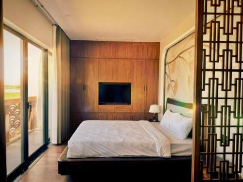 Ένα ή περισσότερα κρεβάτια σε δωμάτιο στο Eden Riverside Apartments
