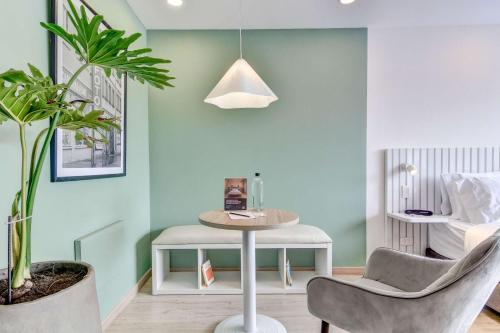 a living room with a table and two chairs at Premium Loft in Bogota in Bogotá