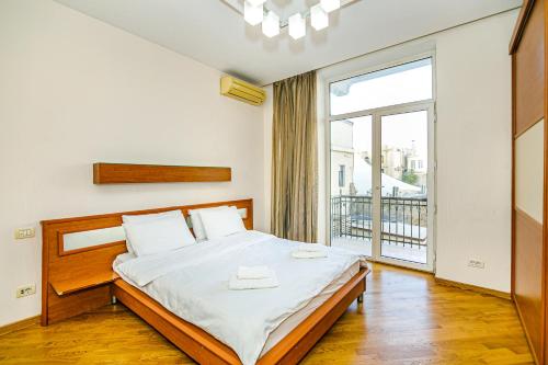 Ένα ή περισσότερα κρεβάτια σε δωμάτιο στο Old Town Apartment by Baku Housing
