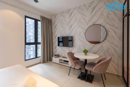 a room with a table and chairs and a mirror at Paxtonz Empire City Damansara Petaling Jaya by Dream Inn in Petaling Jaya