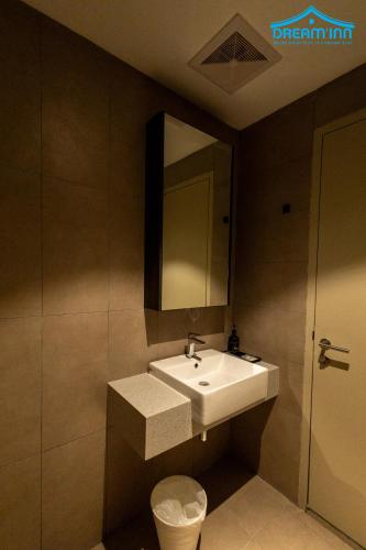 a bathroom with a sink and a mirror at Paxtonz Empire City Damansara Petaling Jaya by Dream Inn in Petaling Jaya