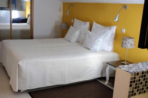 Un ou plusieurs lits dans un hébergement de l'établissement Luzmar Villas