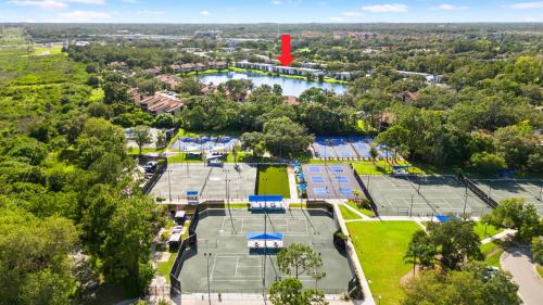 an aerial view of a park with tennis courts at Modern Condo on the lake Oldsmar FL in Oldsmar