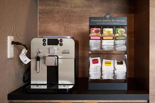 a coffee machine sitting on a counter in a room at HOTEL R9 The Yard Mizunami in Mizunami