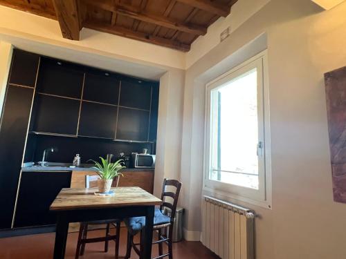 a dining room with a table and a window at Florence in the Window in Florence