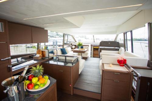 a kitchen and a living room on a boat at Saigon Luxury Private Yacht Prestige 590 - Managed by Vietyacht Club in Ho Chi Minh City