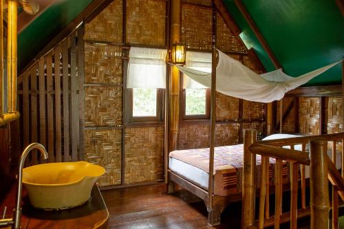 En eller flere senge i et værelse på Our Jungle Camp - Eco Resort
