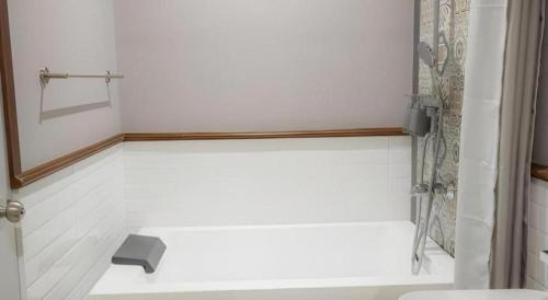 a bathroom with a shower and a toilet at My BanLao Hotel in Luang Prabang