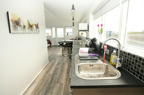A kitchen or kitchenette at Skýjaborg Apartments