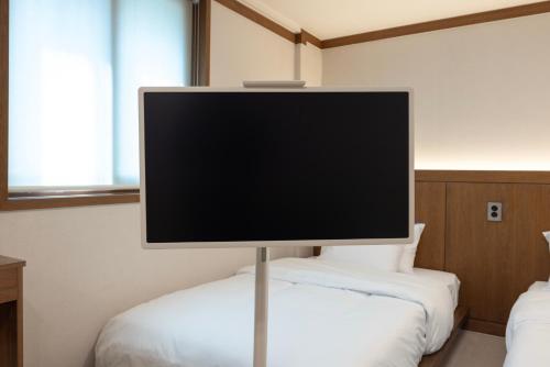Postel nebo postele na pokoji v ubytování Glen Stay Dongducheon