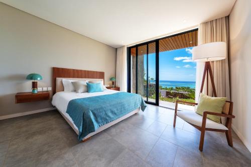 Ένα ή περισσότερα κρεβάτια σε δωμάτιο στο Domaine d'Anbalaba - Baie du Cap - Ile Maurice