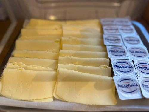 a bunch of cheese sitting on a table at Hotel Ravello Adults Only in Rimini