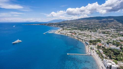 an aerial view of a beach with a boat in the water at Gaia Garden in Kos Town