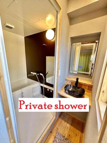 a small bathroom with a sink and a mirror at Fuji Dome Glamping in Fujikawaguchiko