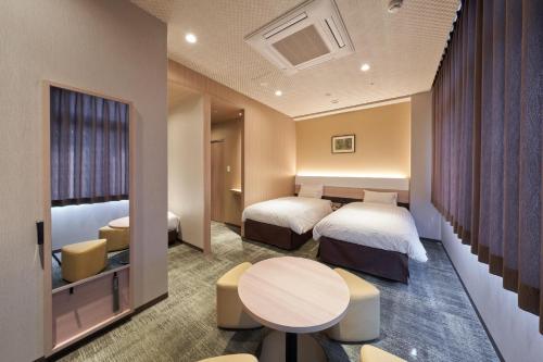 Ένα ή περισσότερα κρεβάτια σε δωμάτιο στο Welina Hotel Premier Nakanoshima West