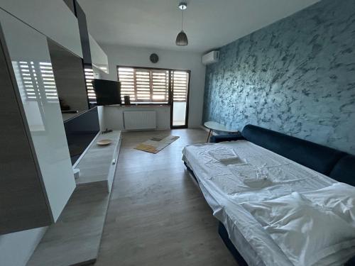 Ένα ή περισσότερα κρεβάτια σε δωμάτιο στο VD Apartament