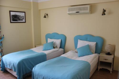 Ένα ή περισσότερα κρεβάτια σε δωμάτιο στο Setenay otel