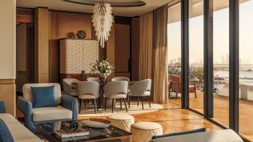 a living room with a table and chairs at Jumeirah Marsa Al Arab Dubai in Dubai