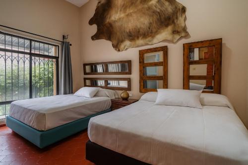 เตียงในห้องที่ Casa de Piedra a 650 metros del Hotel Rosewood