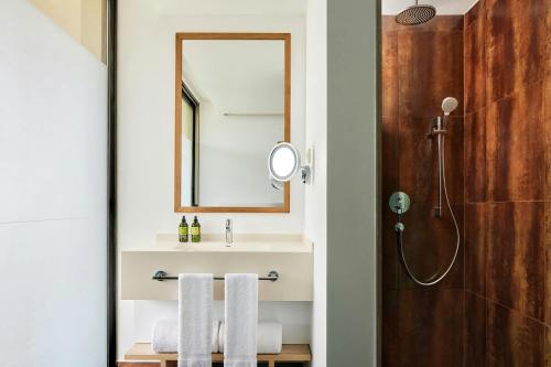 a bathroom with a sink and a mirror at Marriott Residences Salgados Resort, Algarve in Albufeira