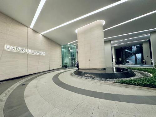 a hallway in a building with a sign on it at Eaton Residences By Classic in Kuala Lumpur