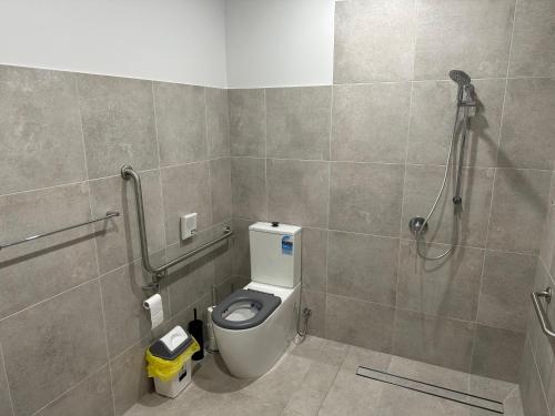 a bathroom with a toilet and a shower at Special Retreat-Beveridge in Beveridge