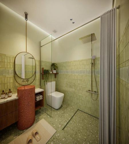 a bathroom with a shower and a toilet and a sink at Magnolia Boutique Hue in Thôn Trường Giang