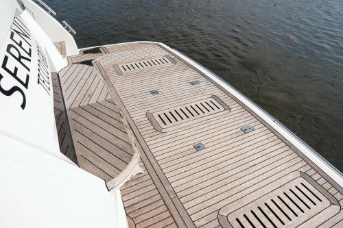 a wooden deck of a boat in the water at Saigon Luxury Private Yacht Prestige 590 - Managed by Vietyacht Club in Ho Chi Minh City