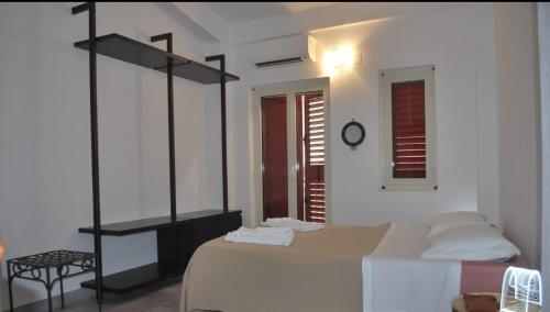 Postel nebo postele na pokoji v ubytování Fior di Mandorlo 1924